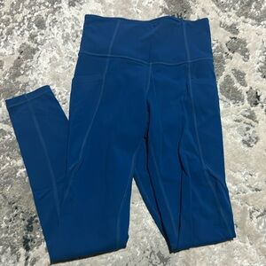 Athleta Salutation Stash SOLD OUT Atlantis Blue leggings with pockets size XS